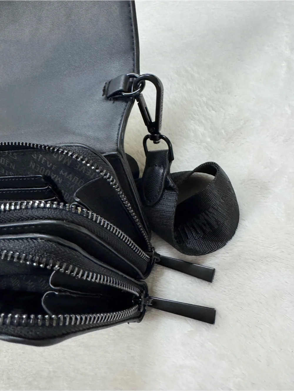 Steve Madden Black Embossed Logo Crossbody Bag.